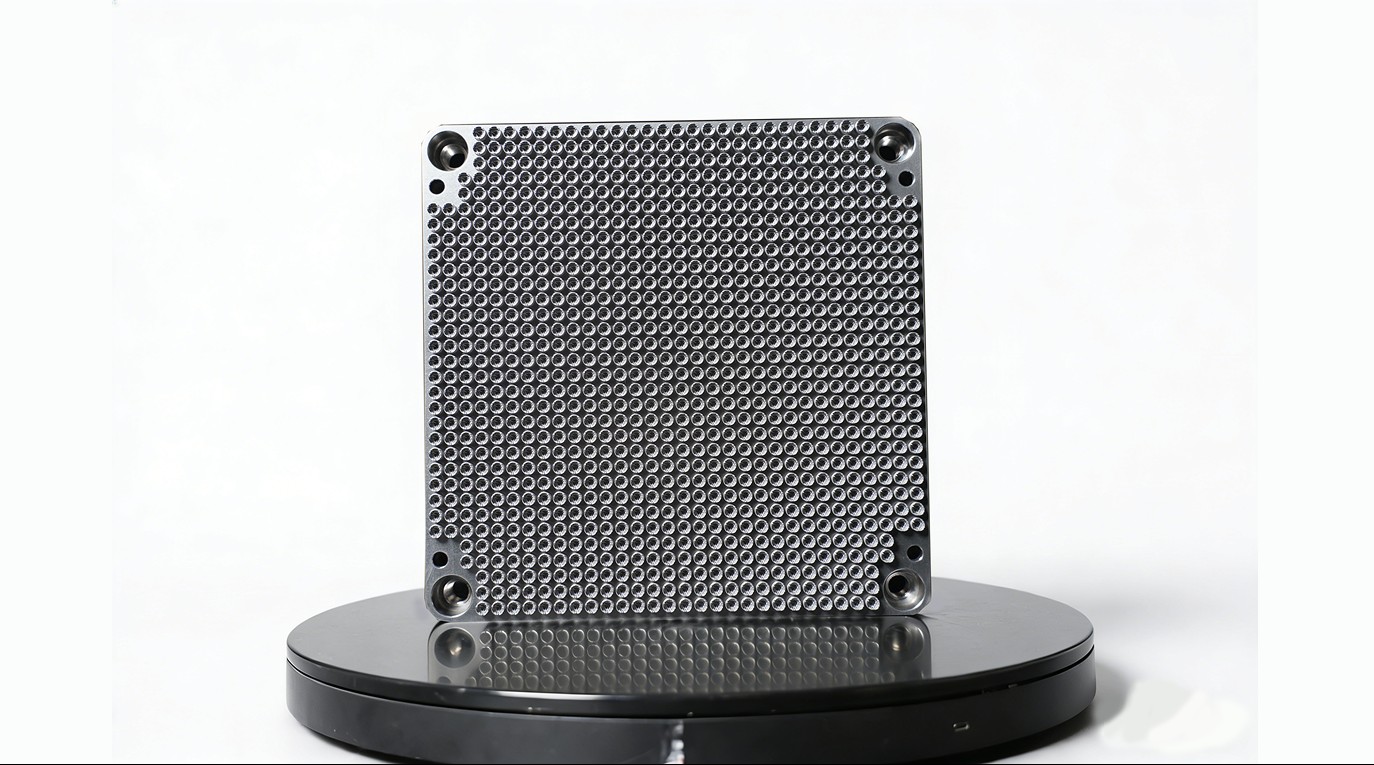 Metal additive micro-orifice grid plate with dense hole field and corner mounts
