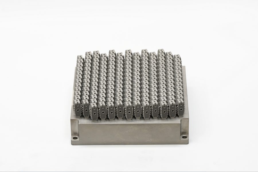 Full build plate of metal additive porous spinal fusion cage blanks